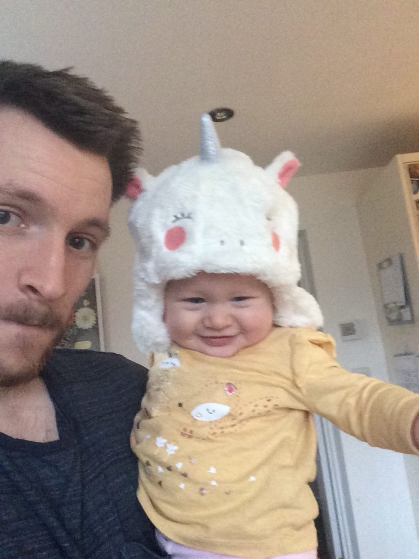 our baby wearing a unicorn hat during my week as a SAHD