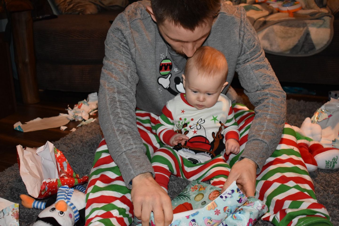 Opening presents with the baby on Christmas Morning