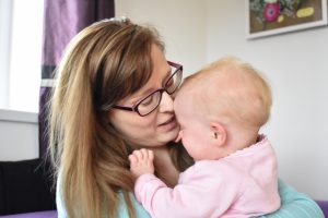 Giving the baby a cuddle during a tantrum
