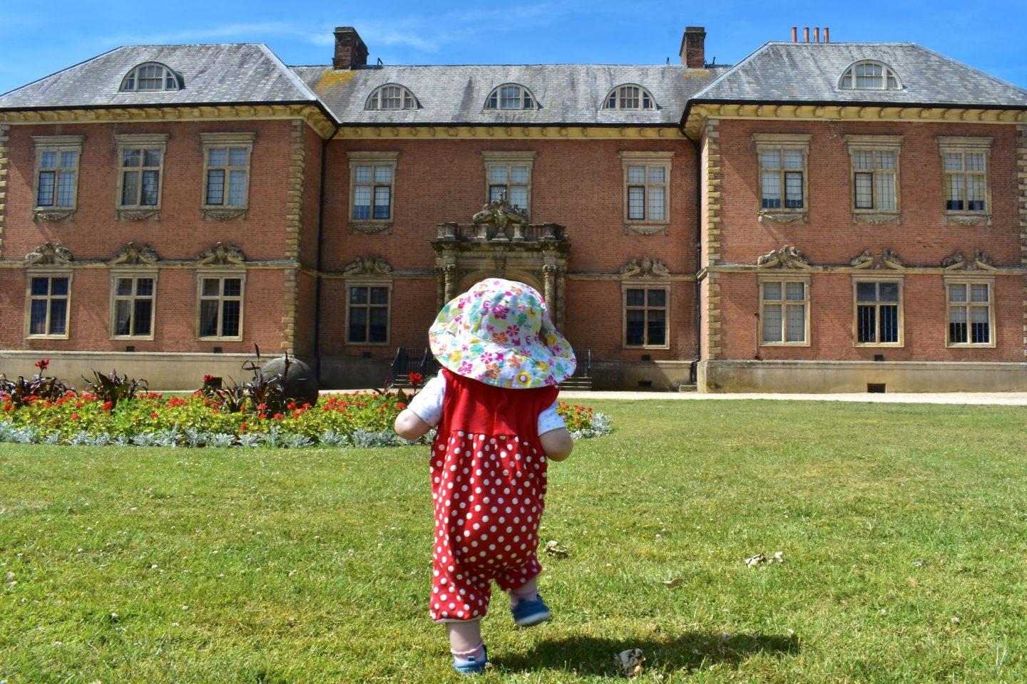 Our daughter Isabelle walking towards Tredegar House at Tredegar House Country Park